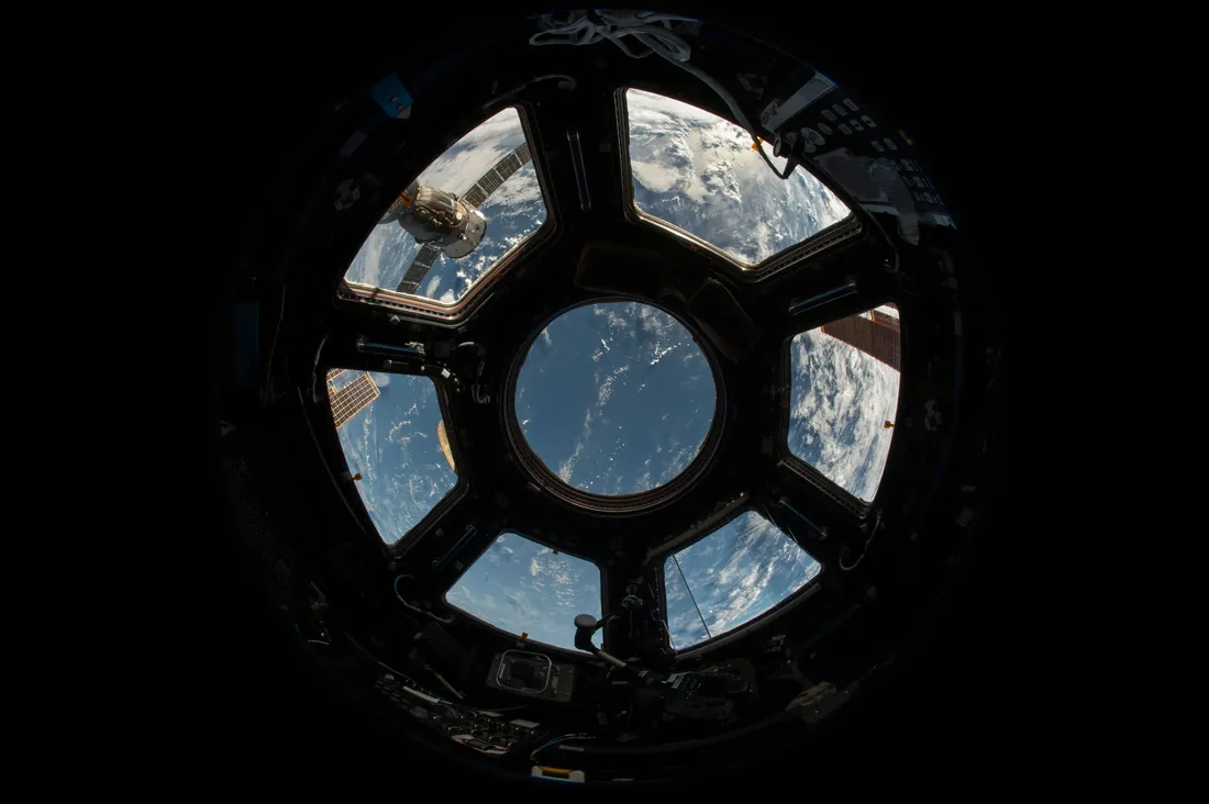 The earth seen from orbit, through the ISS's Cupola module